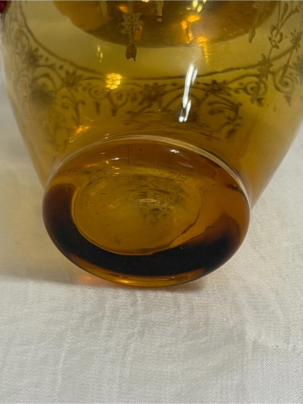 Vecchia Murano vintage amber glass vase with 24K gold trim and red cones.